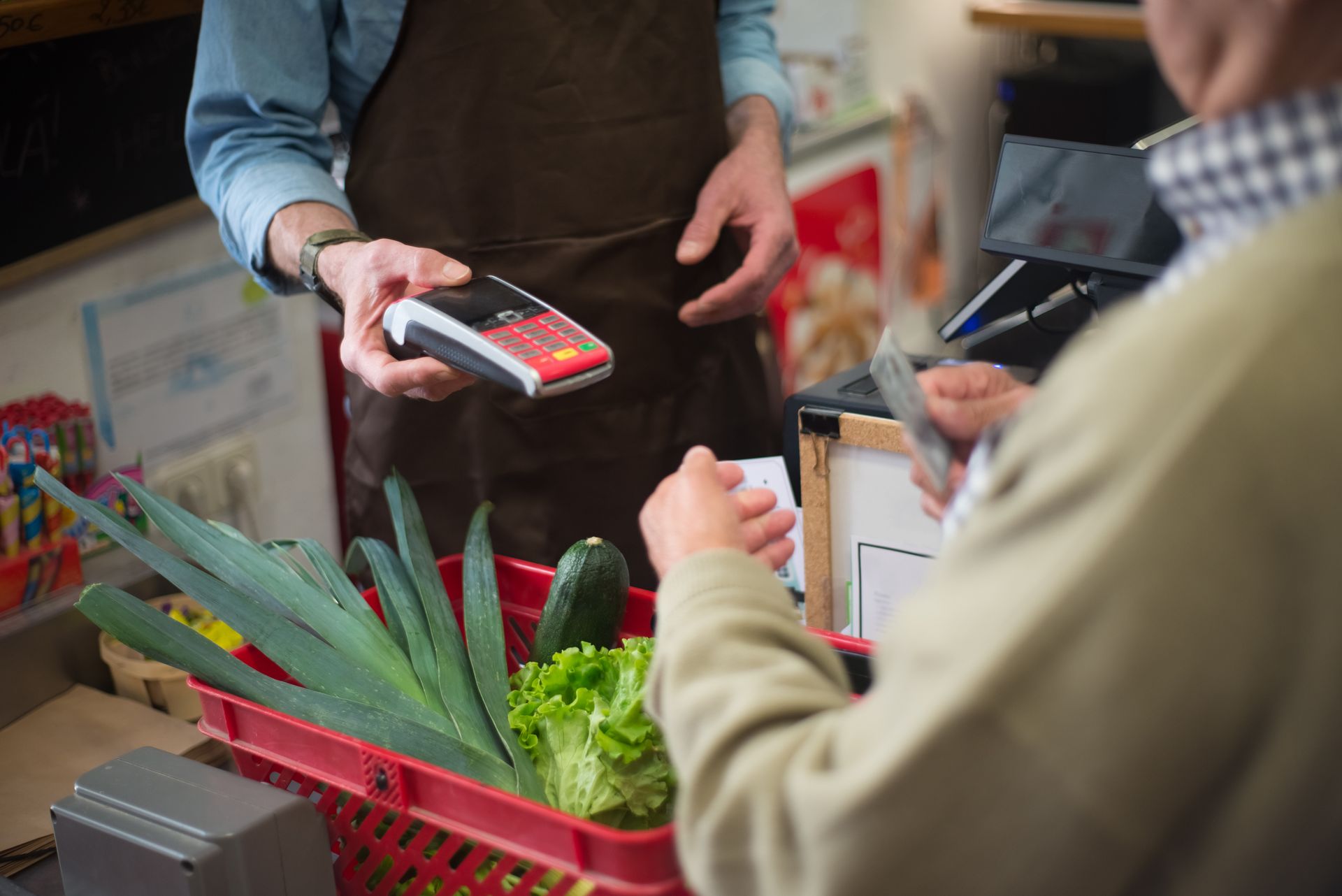 Retail POS software billing interface on counter terminal with barcode scanner and thermal receipt printer